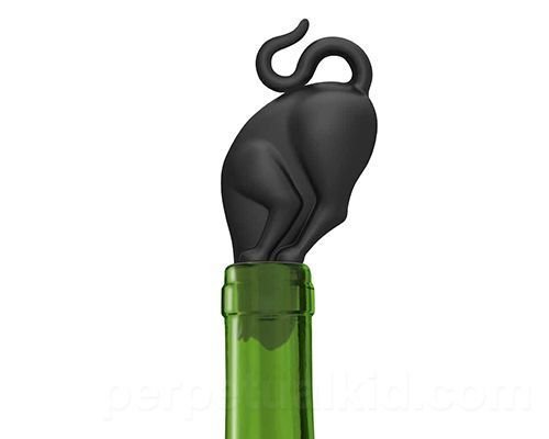 Cat with its head in a wine bottle